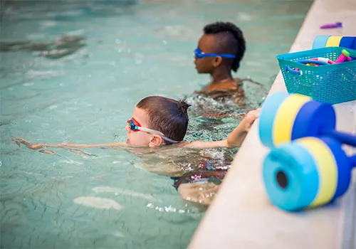 children learning to swim